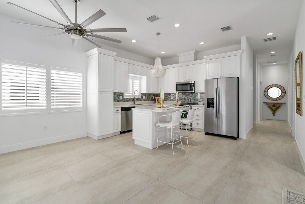 The Durability of Tile flooring in the open style kitchen by Custom Carpets Center in Western NY