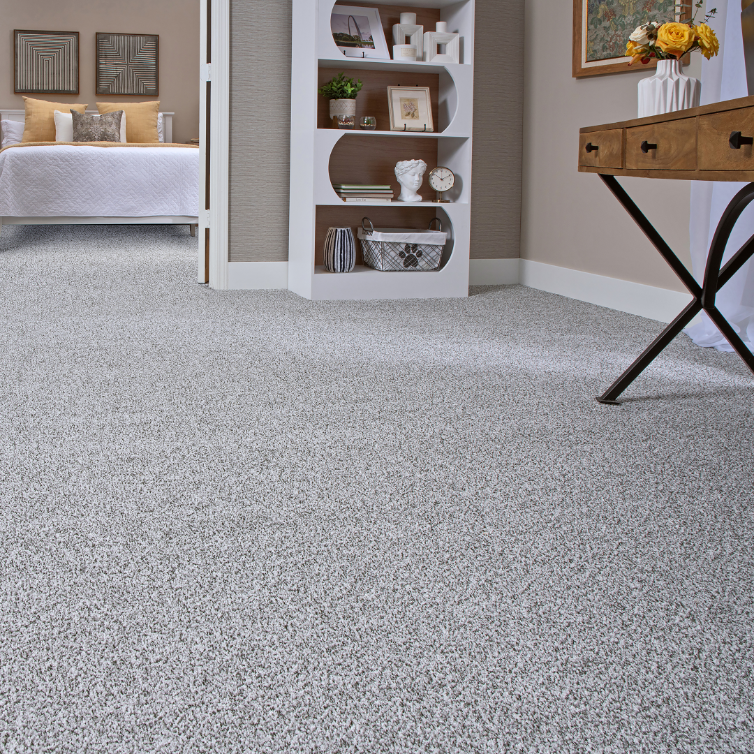 Soft gray carpet flooring in a bedroom and adjoining living space
