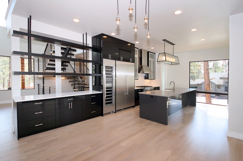 Light hardwood flooring in a modern open-concept kitchen
