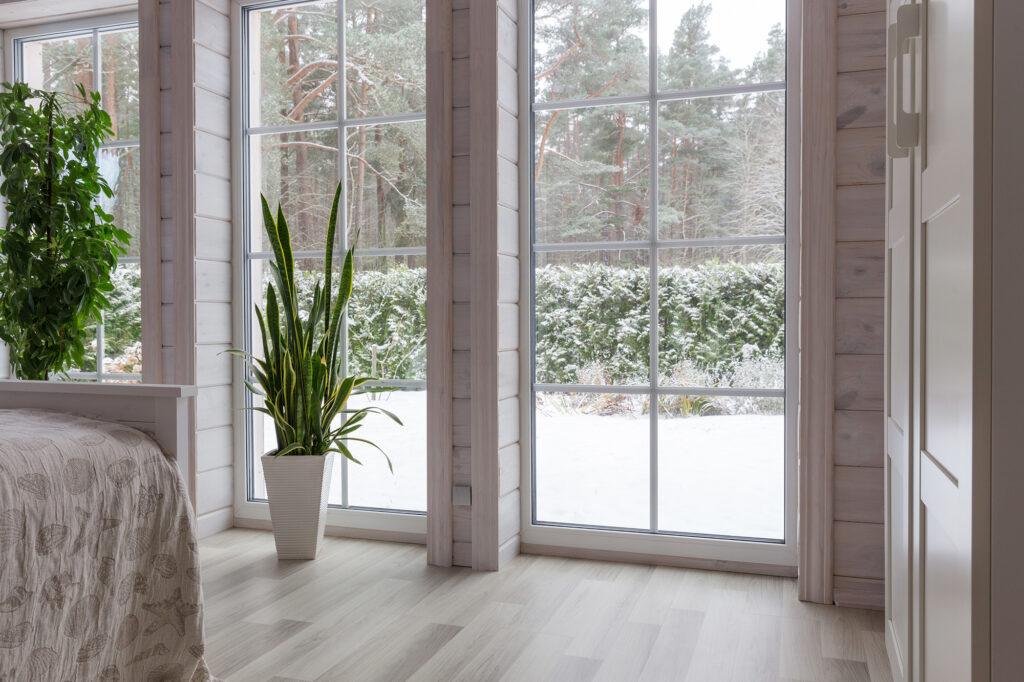 Light colored hardwood flooring in a snowy Western New York home from Custom Carpet Centers